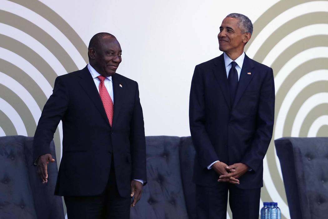 Former President Barack Obama, right, stands with President Cyril Ramaphosa as Obama arrives at the Wanderers Stadium in Johannesburg, South Africa, Tuesday, July 17, 2018 to deliver the 16th Ann ...