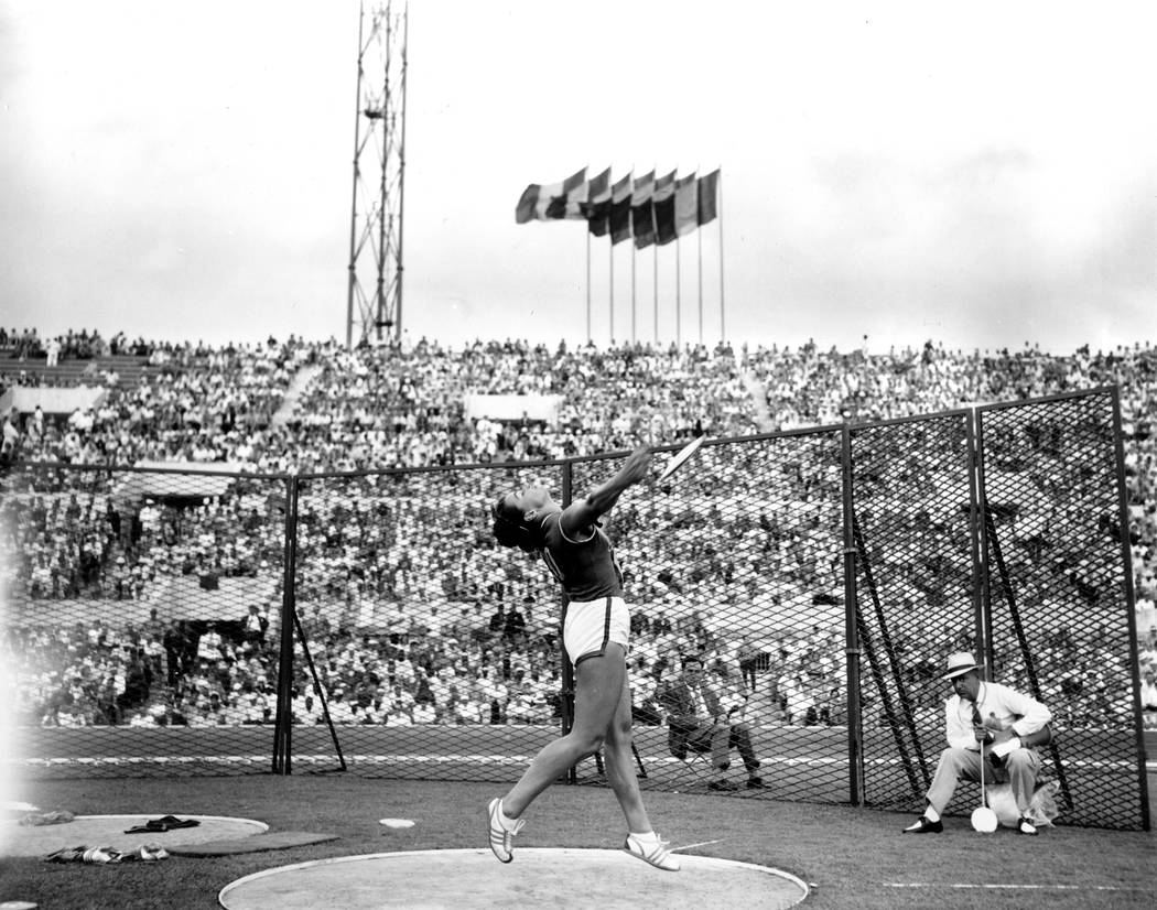 Olga Connolly, the former Olga Fikotova of Czechoslovakia, throws the discus during the Olympic games at the Stadio Olympico in Rome, Italy on Sept. 5, 1960. (AP Photo)