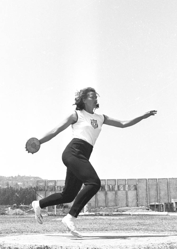 Olga Connolly, the former Olga Fikotova of Czechoslovakia, practices with the discuss at the UCLA Athletic Field in Los Angeles, Ca. on July 15, 1964. Olga Fikotova won the gold at the 1956 Olymp ...