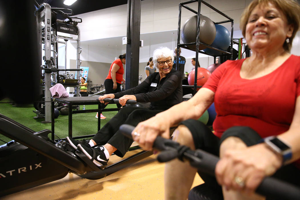 Fitness coach Olga Connolly, left, 85, works with Priscilla Whitt at the EoS Fitness gym, 7070 S Durango Drive, in Las Vegas, Wednesday, July 18, 2018. Connolly is a former Olympian who won a gold ...