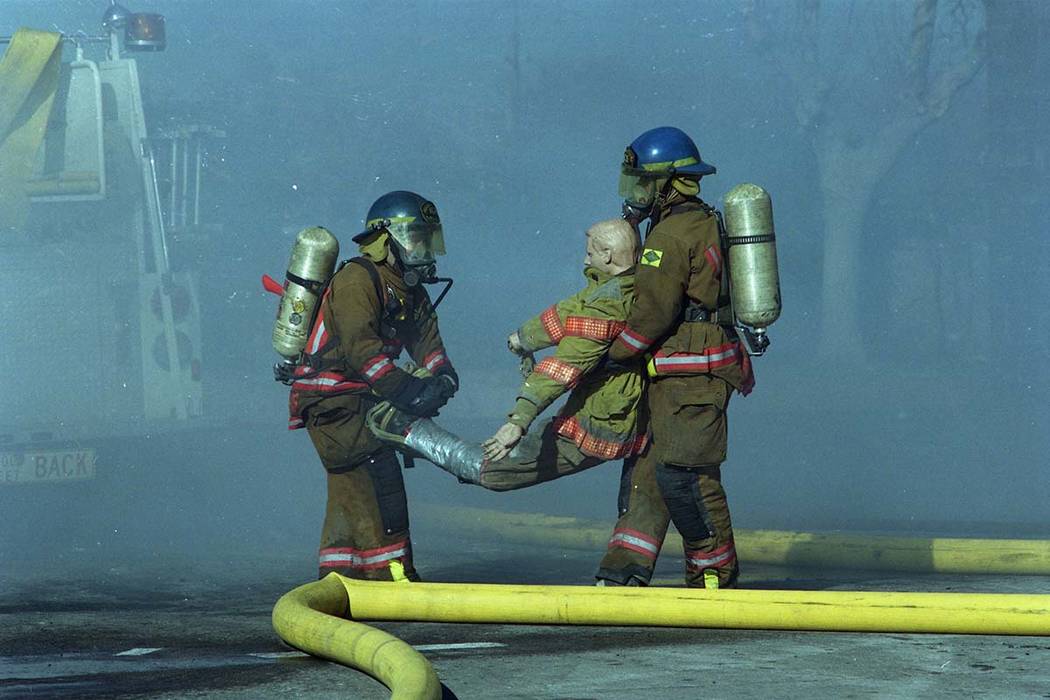Firefighters train during a fire safety demonstration at the Las Vegas Fire Department Fire Training Center 633 North Mojave Road at East Bonanza Road in this February, 1999, photo. (Las Vegas Rev ...