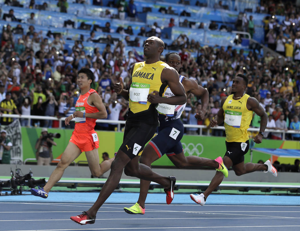 Jamaica's Usain Bolt checks his time during a men's 100-meter first round heat in Rio de Janeiro, Brazil, Saturday, Aug. 13, 2016. (Matt Slocum/The Associated Press)
