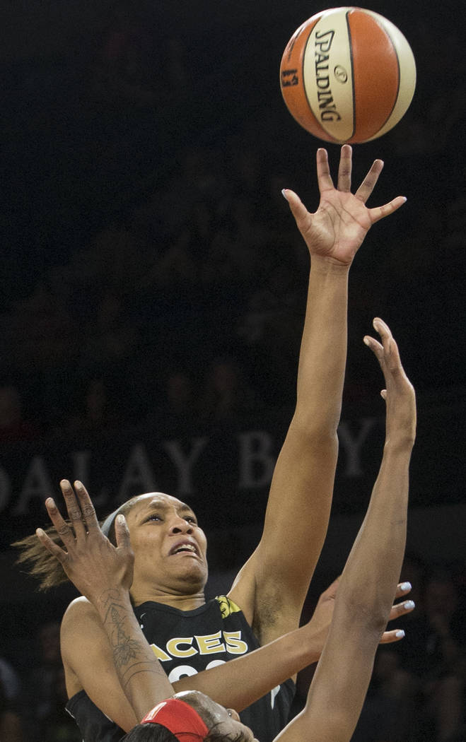Aces center A'ja Wilson (22) shoots a jump shot over Dallas Wings forward Kaela Davis (3) in the 2nd quarter on Wednesday, June 27, 2018, at the Mandalay Bay Events Center, in Las Vegas. Benjamin ...