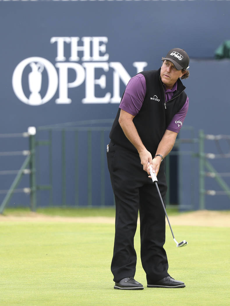 Phil Mickelson of the United States putts on the 18th green during a practice round for the 147th Open golf Championship at Carnoustie golf club, Scotland, Tuesday, July 17th 2018. (AP Photo/Peter ...