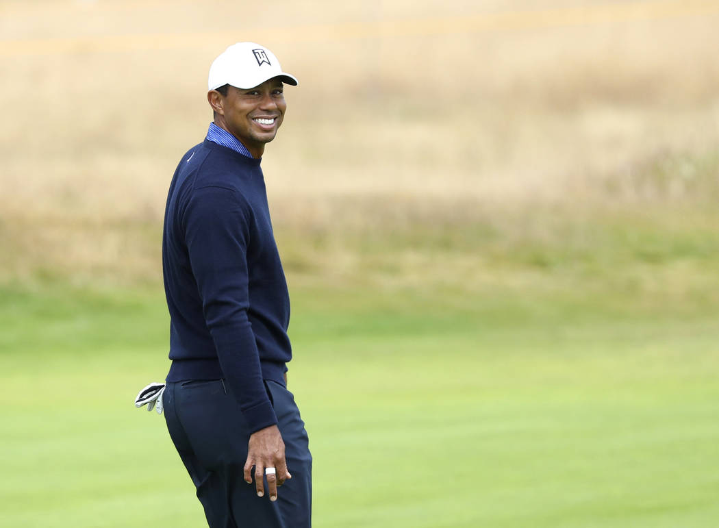 Tiger Woods of the U.S. smiles during a practice round for the 147th British Open Golf championships in Carnoustie, Scotland, Tuesday, July 17, 2018. (AP Photo/Peter Morrison)