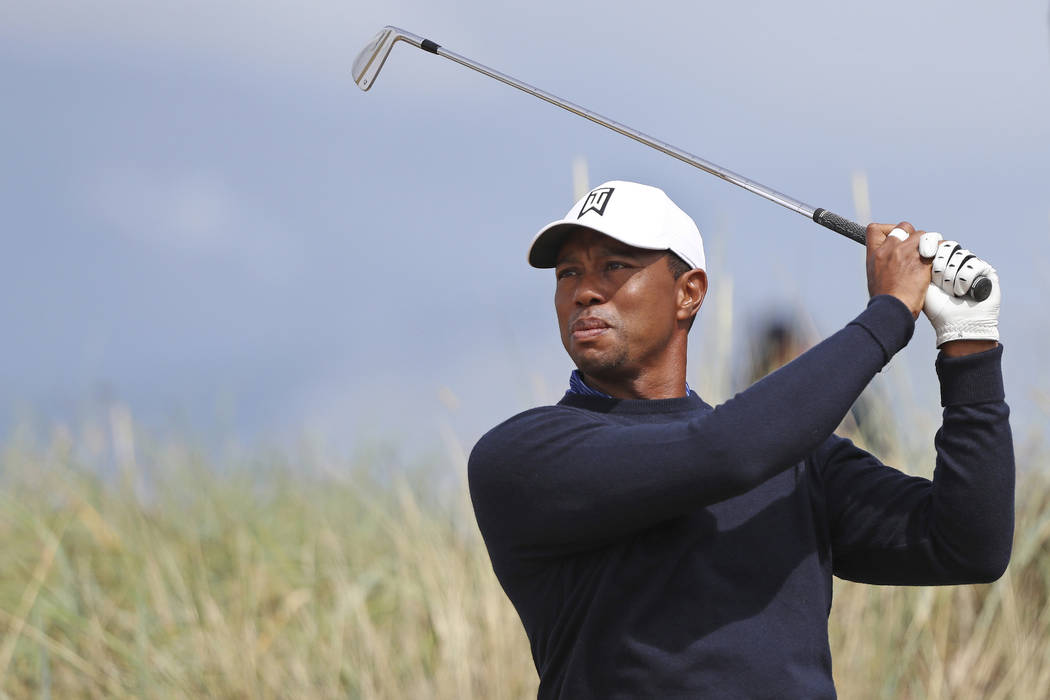 Tiger Woods of the U.S. tees off on the 6th hole during a practice round for the 147th British Open Golf championships in Carnoustie, Scotland, Tuesday, July 17, 2018. (AP Photo/Peter Morrison)