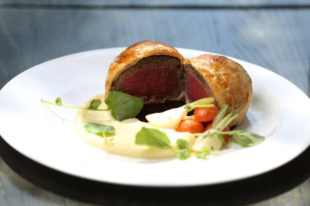 The beef wellington, served with potato puree, glazed root vegetables and red wine demi glace, at Gordon Ramsay Hell's Kitchen in Las Vegas, Tuesday, July 17, 2018. Erik Verduzco Las Vegas Review- ...