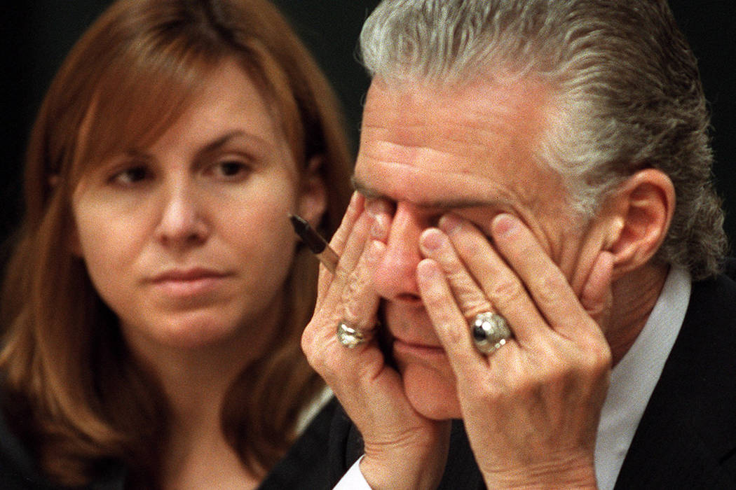 John Momot rubs his eyes as his client Sandra Murphy glances over while Judge Joseph Bonaventure discusses Murphy's house arrest in 2001. (Jeff Scheid/Las Vegas Review-Journal)