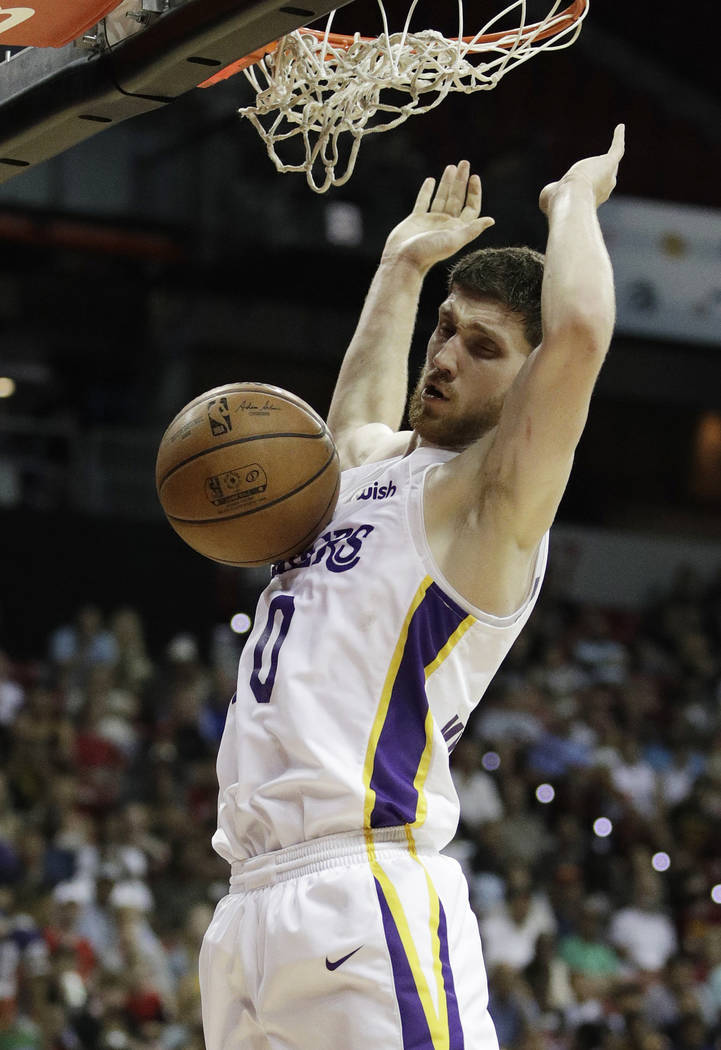 Los Angeles Lakers' Sviatoslav Mykhailiuk dunks against the Cleveland Cavaliers during the second half of an NBA summer league basketball game Monday, July 16, 2018, in Las Vegas. (AP Photo/John L ...