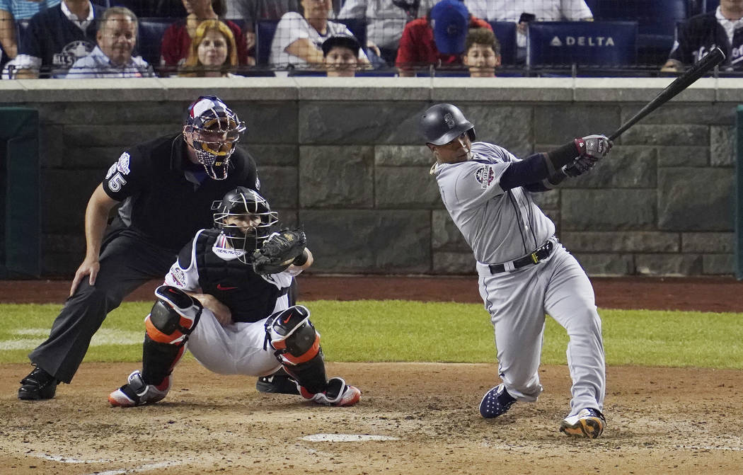 Seattle Mariners Jean Segura (2) hits a three-run homer in the eighth inning during the 89th MLB baseball All-Star Game, Tuesday, July 17, 2018, at Nationals Park, in Washington. (AP Photo/Carolyn ...