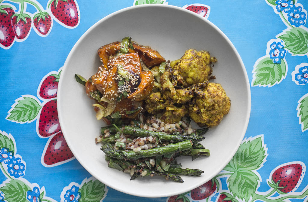 Red chili glazed sweet potato with bak choy sesame seed, indian spiced cauliflower with turmeric, date and almond and grilled asparagus with ancient grains and ginger miso at Flower Child on Frida ...