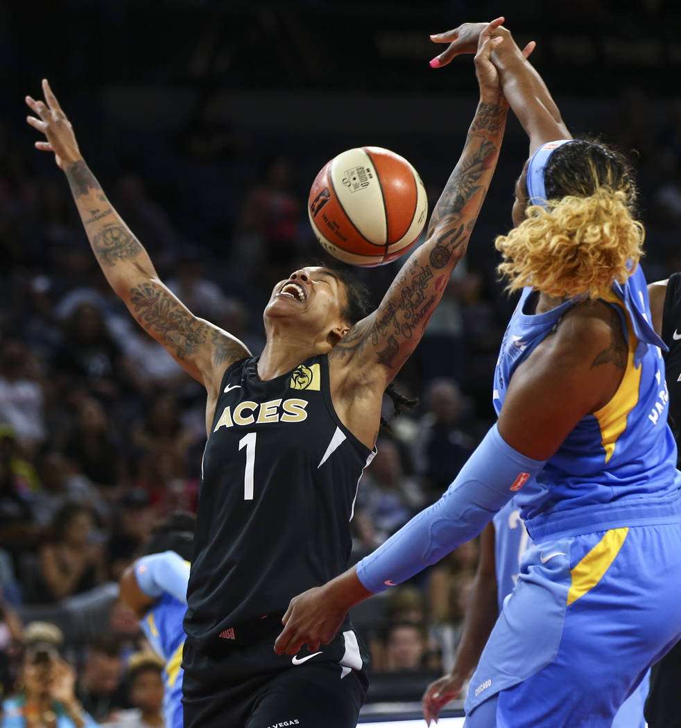 Las Vegas Aces forward Tamera Young (1) loses control of the ball in front of Chicago Sky forward Cheyenne Parker (32) during the second half of a WNBA basketball game at Mandalay Bay Events Cente ...