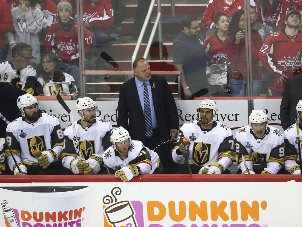 Golden Knights head coach Gerard Gallant, center, looks on during the third period of Game 3 of the NHL hockey Stanley Cup Final against the Washington Capitals at Capital One Arena in Washington ...