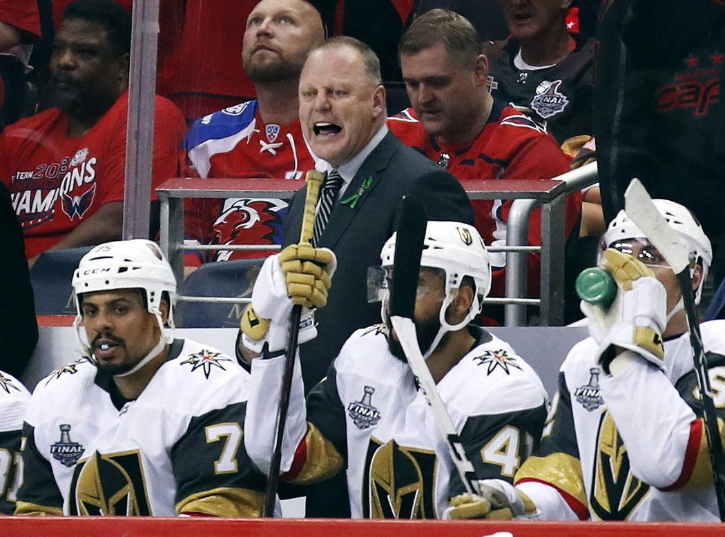 Vegas Golden Knights head coach Gerard Gallant watches from behind the bench during the third period in Game 4 of the NHL hockey Stanley Cup Final against the Washington Capitals, Monday, June 4, ...