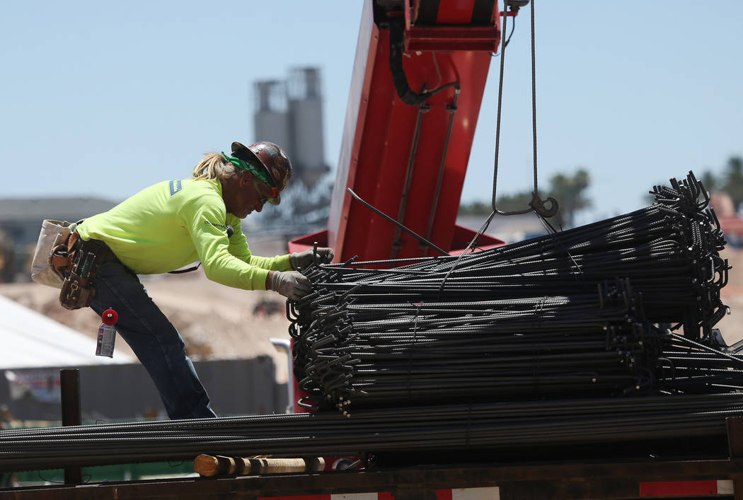A worker moves steel on the construction site for the future Raiders stadium in Las Vegas, Thursday, June 28, 2018. Erik Verduzco Las Vegas Review-Journal @Erik_Verduzco
