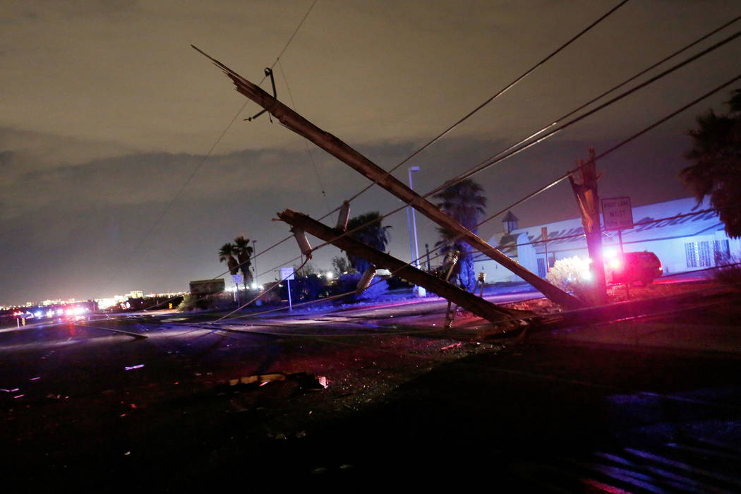 Downed power lines are seen on Boulder Highway between Russell and Sunset on Thursday, July 19, 2018, in Henderson. (Chitose Suzuki/Las Vegas Review-Journal @chitosephoto)