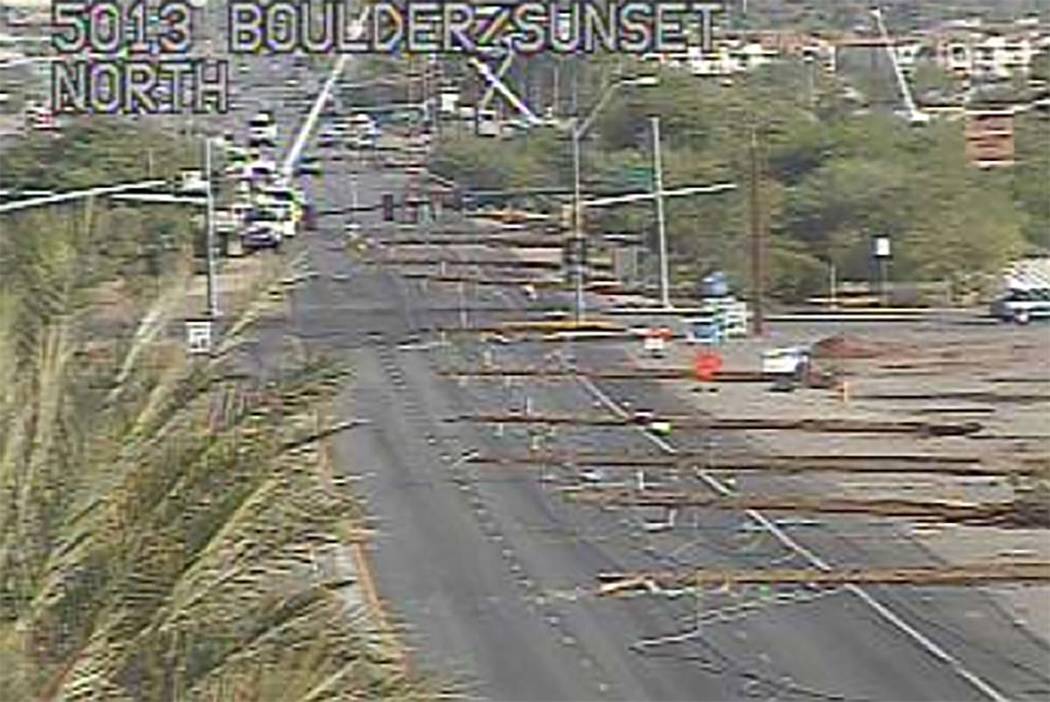 Crews from NV Energy work on Boulder Highway near Sunset Road, Friday, July 20, 2018, to repair power lines damaged in Thursday night's thunderstorm. (RTC Fast Cameras)