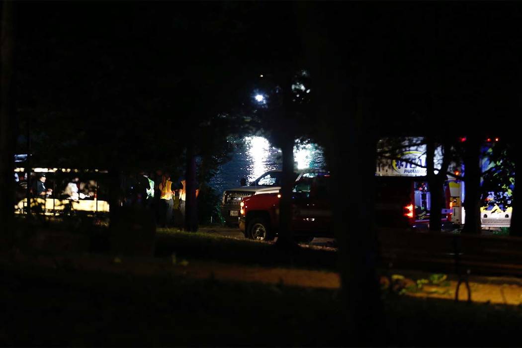 Emergency responders work at Table Rock Lake after a deadly boat accident in Branson, Mo., Thursday, July 19, 2018. A sheriff in Missouri said a tourist boat has apparently capsized on the lake, l ...