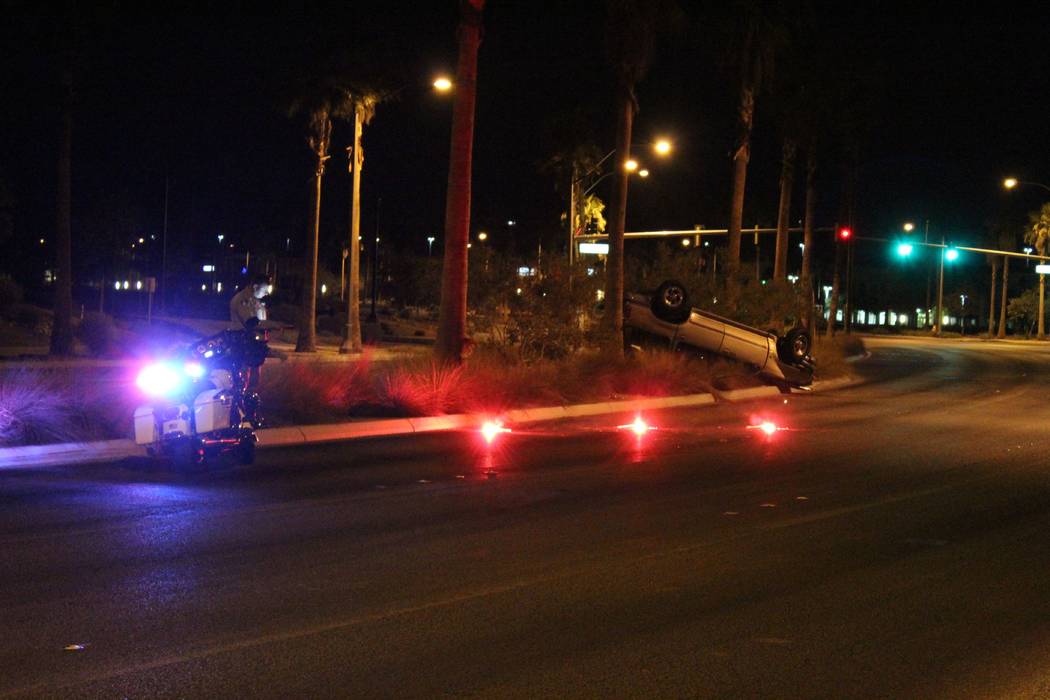 Las Vegas police investigate a July 20, 2018, rollover crash on Tropical Parkway near Durango Drive. (Max Michor/Las Vegas Review-Journal)