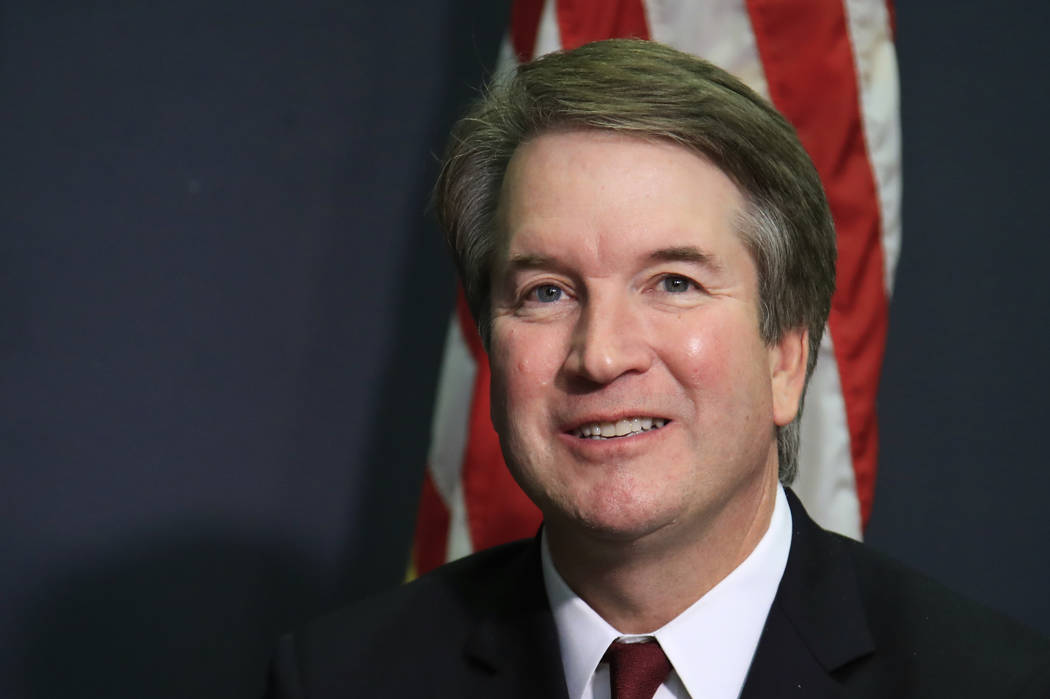 Supreme Court nominee Brett Kavanaugh glances at reporters during a meeting with Sen. James Lankford, R-Okla., on Capitol Hill in Washington, July 19, 2018. (Manuel Balce Ceneta/AP)
