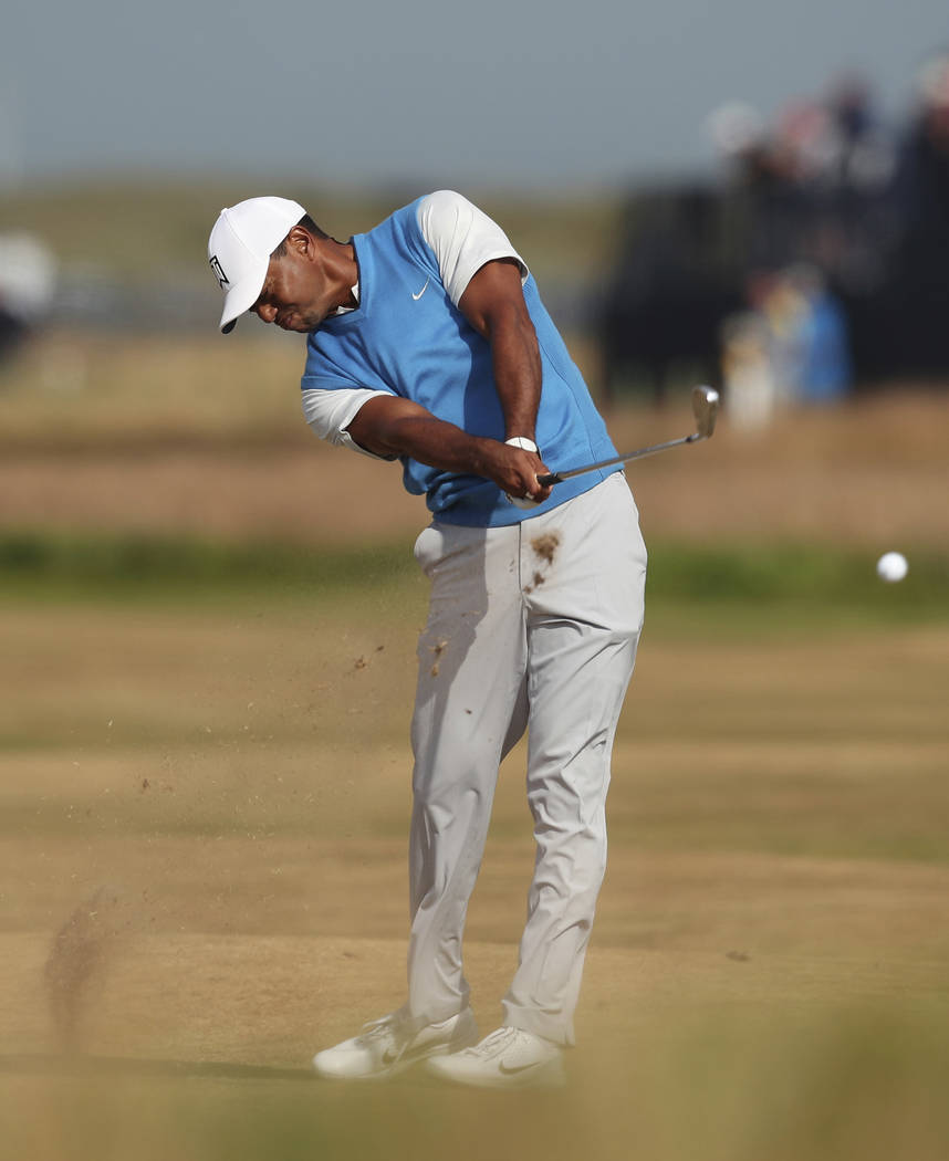 Tiger Woods of the US plays a shot on the 7th hole during the first round of the British Open Golf Championship in Carnoustie, Scotland, Thursday July 19, 2018. (AP Photo/Jon Super)