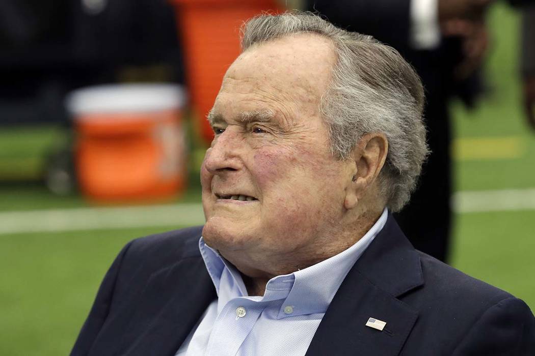 Former president George H.W. Bush arrives for an NFL football game between the Houston Texans and the Indianapolis Colts in Houston in 2017. (AP Photo/David J. Phillip, File)