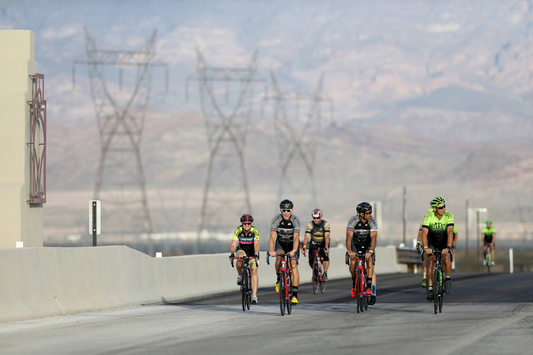 Cyclists ride on the yet-to-be-opened Interstate 11 in Boulder City Saturday, July 21, 2018. The event, sponsored by the Southern Nevada Bicycle Coalition, gave people a chance to ride on the free ...