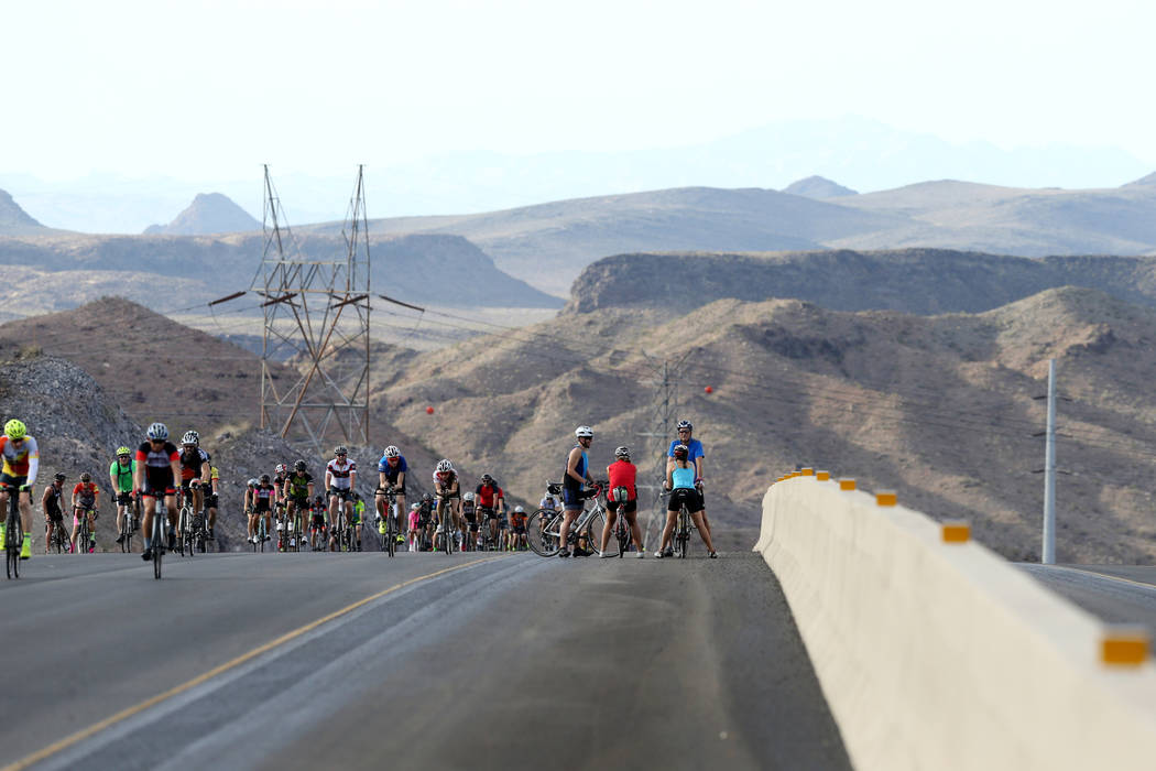 Cyclists ride on the yet-to-be-opened Interstate 11 in Boulder City Saturday, July 21, 2018. The event, sponsored by the Southern Nevada Bicycle Coalition, gave people a chance to ride on the free ...