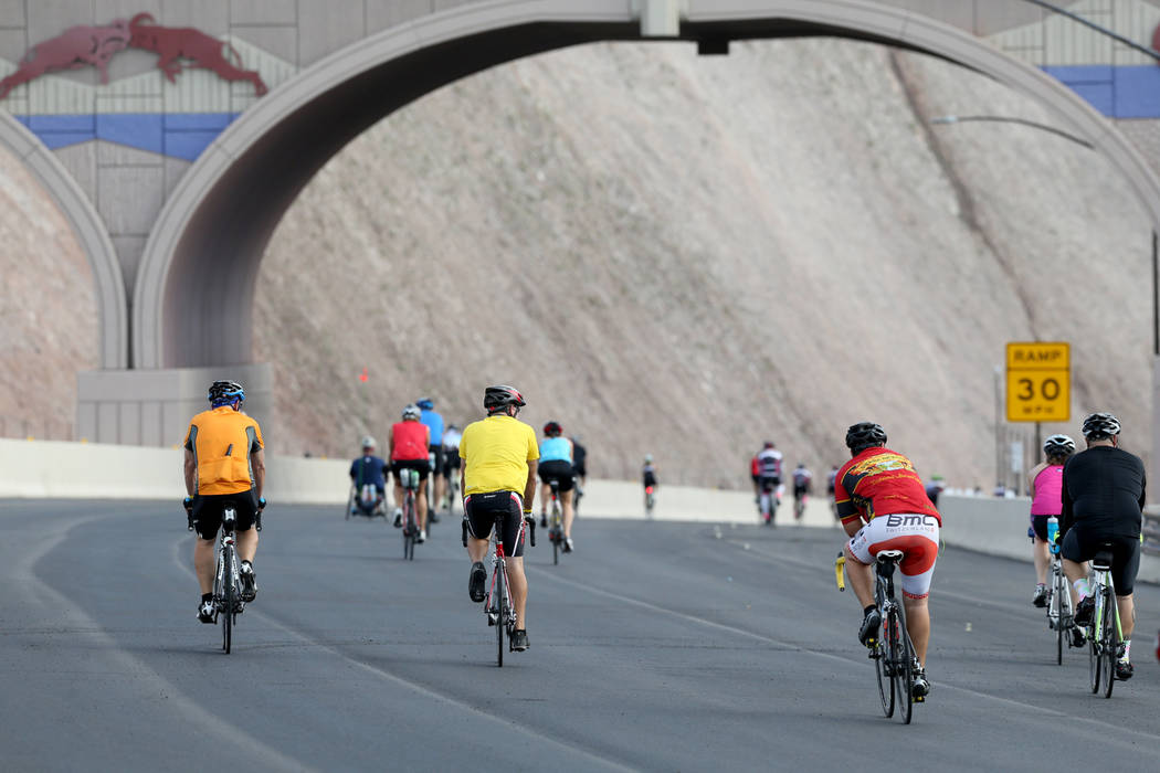 Cyclists ride under a wildlife bridge on the yet-to-be-opened Interstate 11 in Boulder City Saturday, July 21, 2018. The event, sponsored by the Southern Nevada Bicycle Coalition, gave people a ch ...