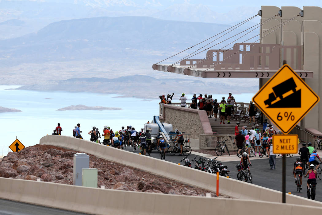 Cyclists check out the overlook above Lake Mead while riding on the yet-to-be-opened Interstate 11 in Boulder City Saturday, July 21, 2018. The event, sponsored by the Southern Nevada Bicycle Coal ...