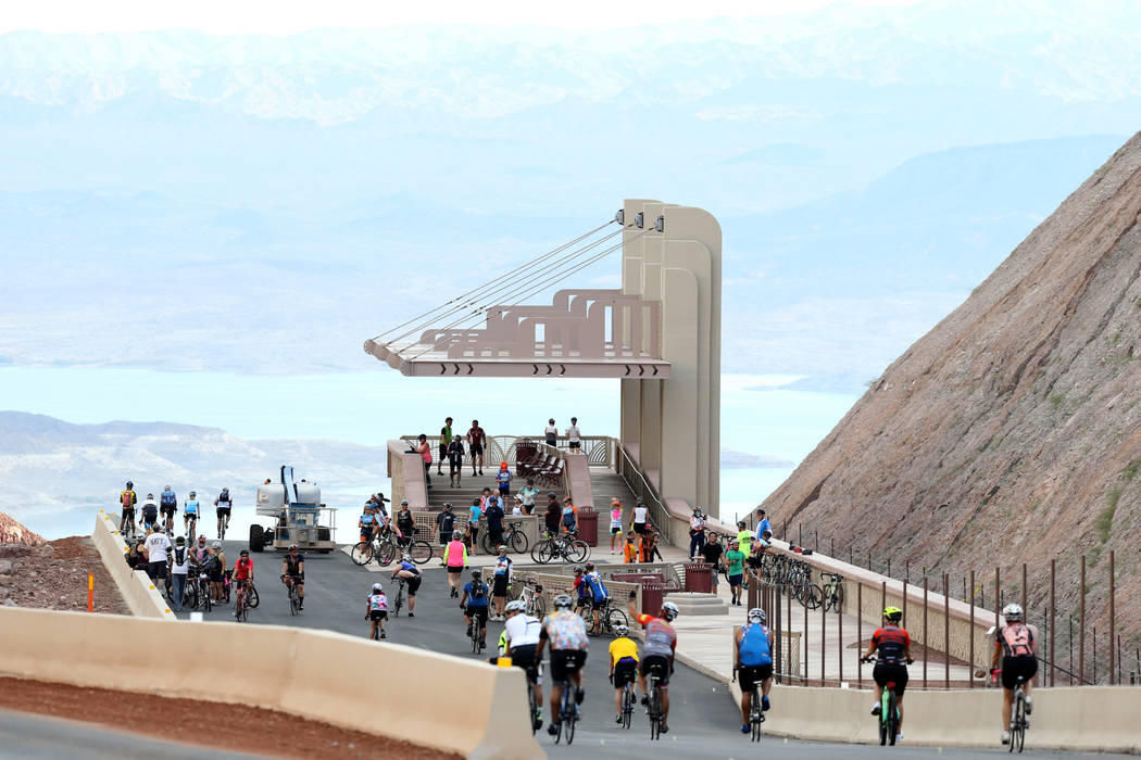 Cyclists check out the overlook above Lake Mead while riding on the yet-to-be-opened Interstate 11 in Boulder City Saturday, July 21, 2018. The event, sponsored by the Southern Nevada Bicycle Coal ...