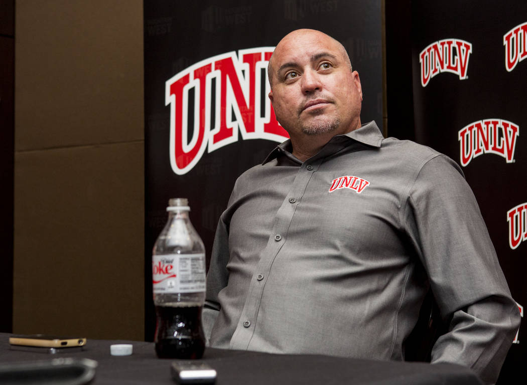 UNLV head football coach Tony Sanchez does an interview with multiple different print medias during the Mountain West Football Media Summit at the Cosmopolitan hotel-casino in Las Vegas, July 25, ...