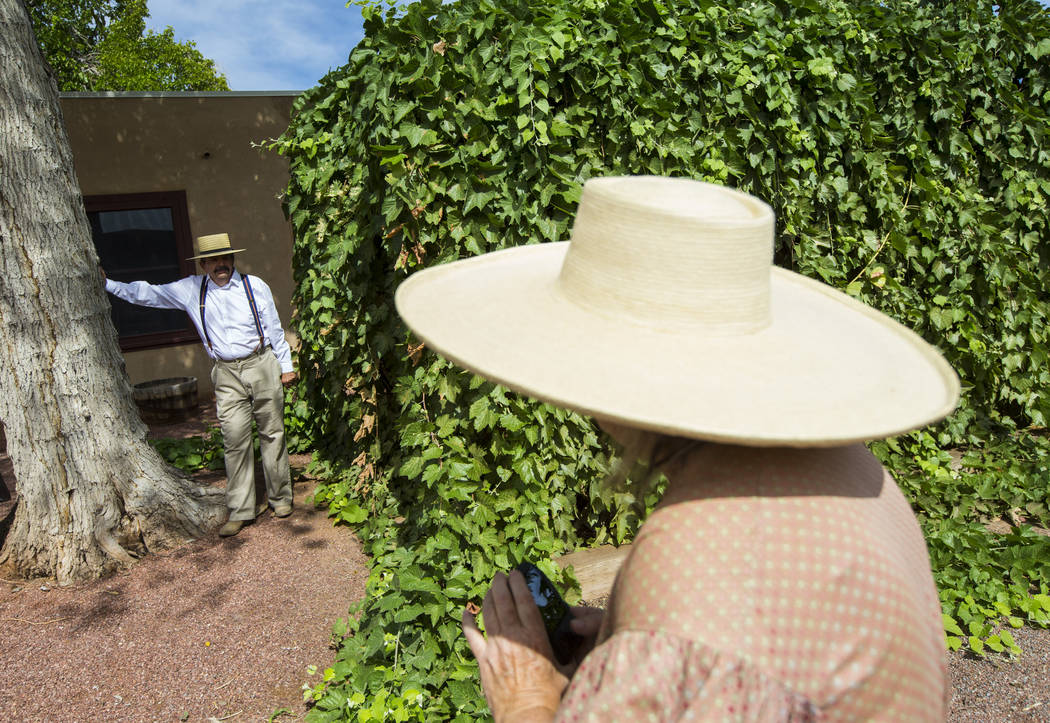 Former Clark County Museum curator Dawna Jolliff, right, photographs husband Mike as the two attend the "Pioneer Day" event at the Old Las Vegas Mormon Fort State Historical Park in Las ...