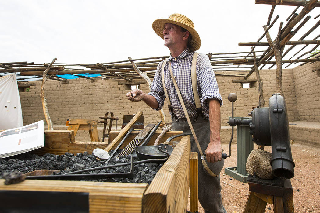 Scott Elkins talks about blacksmithing during the "Pioneer Day" event at the Old Las Vegas Mormon Fort State Historical Park in Las Vegas on Saturday, July 21, 2018. Chase Stevens Las Ve ...