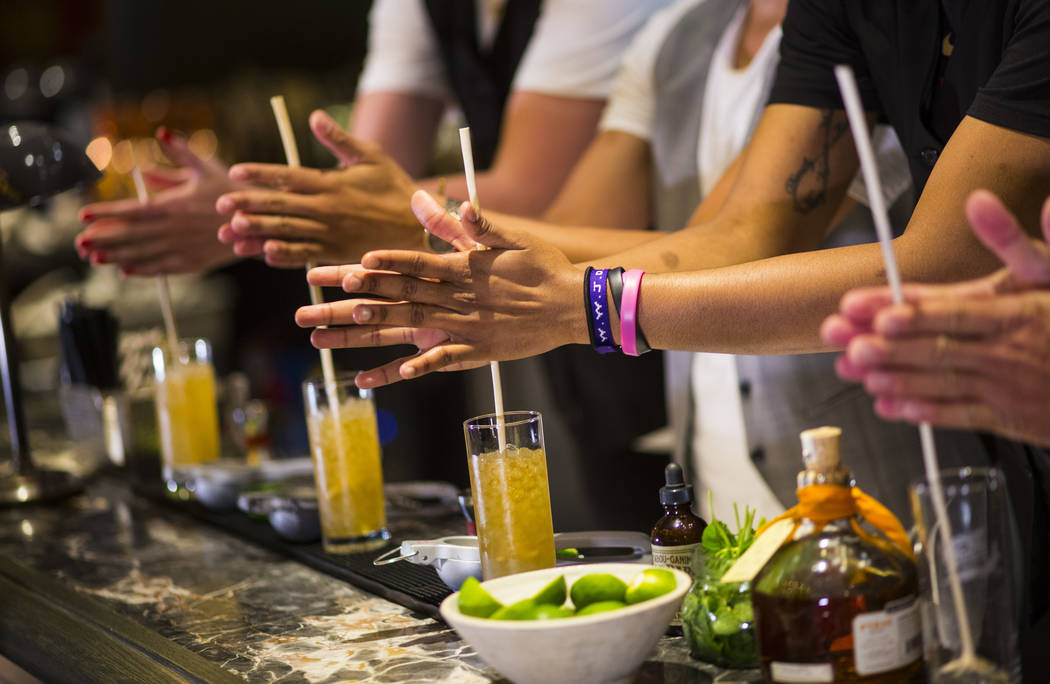 Las Vegas Aces players make a Summer Swizzle cocktail with the help of mixologist Tony Abou-Ganim at Libertine Social in the Mandalay Bay in Las Vegas on Saturday, July 21, 2018. Chase Stevens Las ...