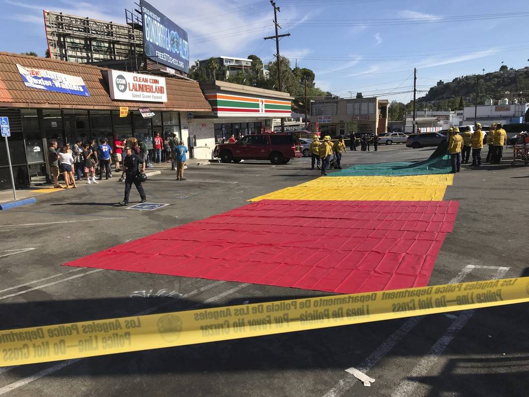 Woman killed in LA supermarket shooting; man arrested Las Vegas