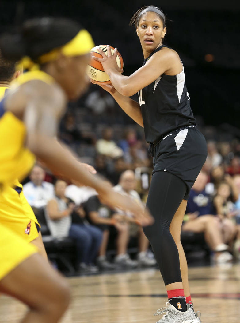 Las Vegas Aces center A'ja Wilson (22) looks for a receiver against the Indiana Fever during the first half of a WNBA basketball game at the Mandalay Bay Events Center in Las Vegas on Sunday, July ...