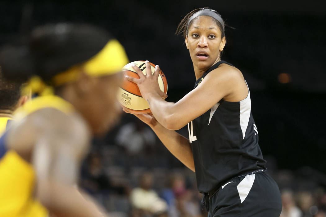 Las Vegas Aces center A'ja Wilson (22) looks for a receiver against the Indiana Fever during the first half of a WNBA basketball game at the Mandalay Bay Events Center in Las Vegas on Sunday, July ...