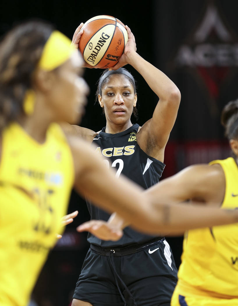 Las Vegas Aces center A'ja Wilson (22) looks to pass against the Indiana Fever during the first half of a WNBA basketball game at the Mandalay Bay Events Center in Las Vegas on Sunday, July 22, 20 ...