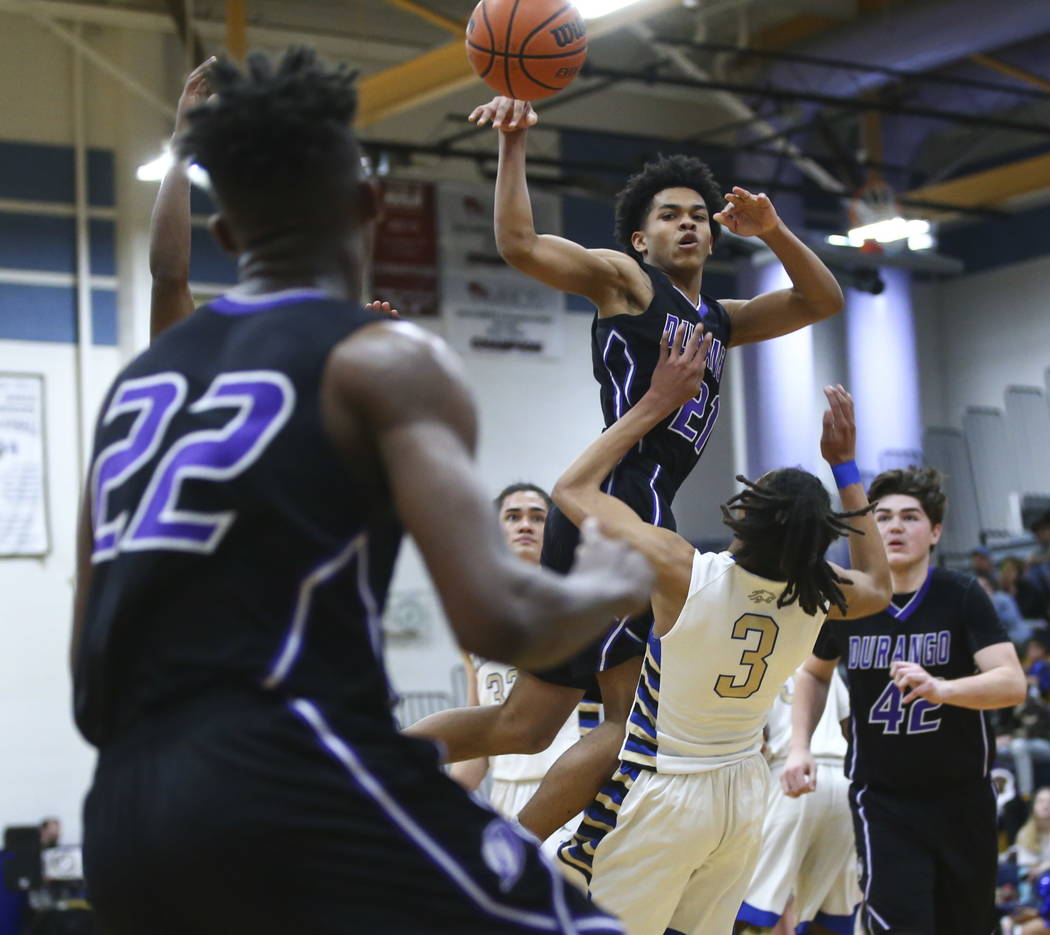 Durango's Anthony Hunter (21) passes the ball to Durango's Vernell Watts (22) during a basketball game at Sierra Vista High School in Las Vegas on Thursday, Feb. 8, 2018. Chase Stevens Las Vegas R ...