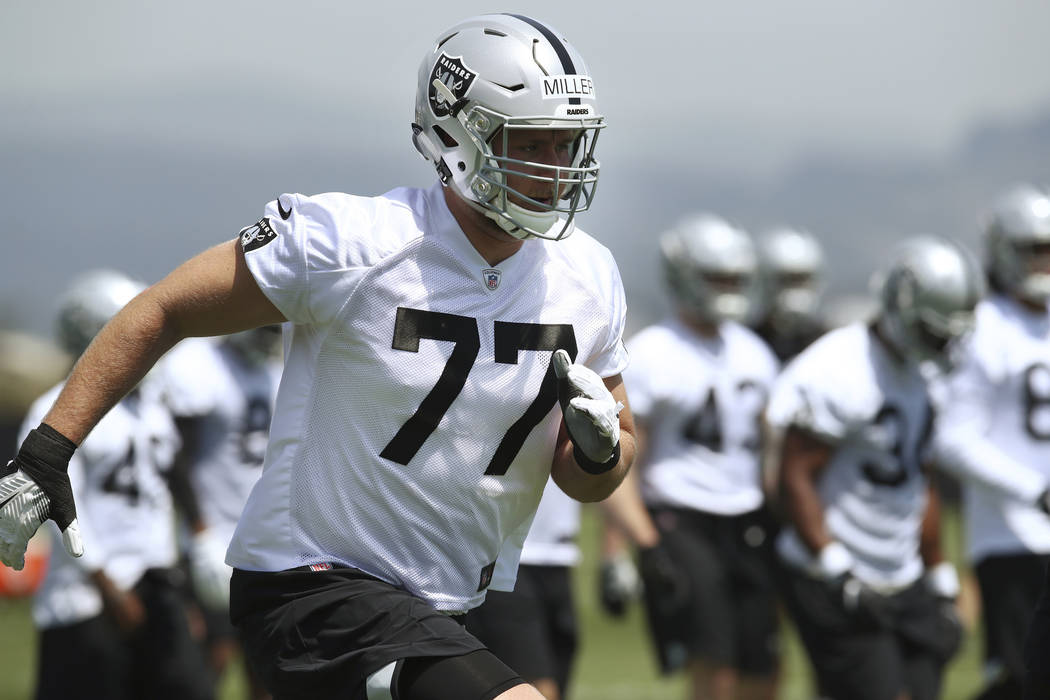 Oakland Raiders' Kolton Miller (77) runs during an NFL football practice on Friday, May 4, 2018, at the team's training facility in Alameda, Calif. (AP Photo/Ben Margot)