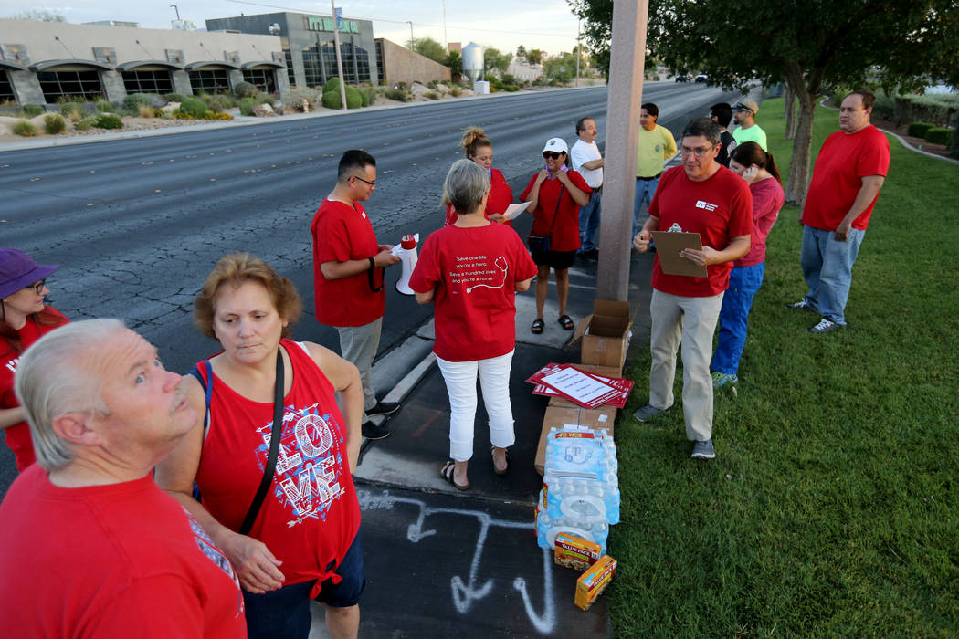 Nurses affiliated with the Nevada chapter of the national Nurses Organizing Committee prepare to protest outside MountainView Hospital in Las Vegas Tuesday, July 24, 2018, to address what they say ...