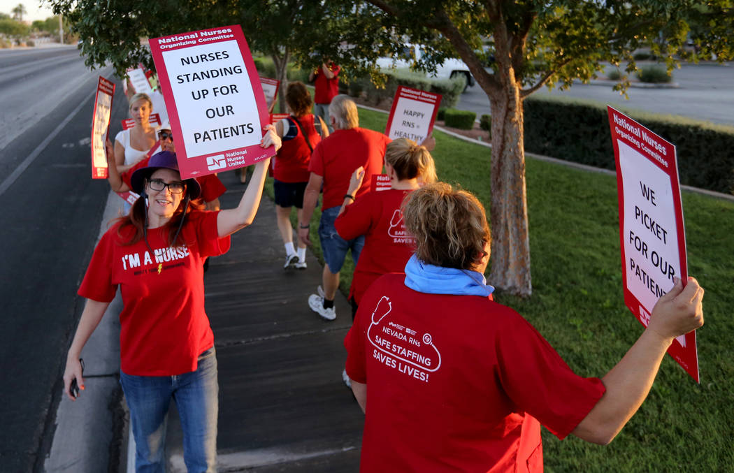 Nurses and supporters affiliated with the Nevada chapter of the national Nurses Organizing Committee protest outside MountainView Hospital in Las Vegas Tuesday, July 24, 2018, to address what they ...