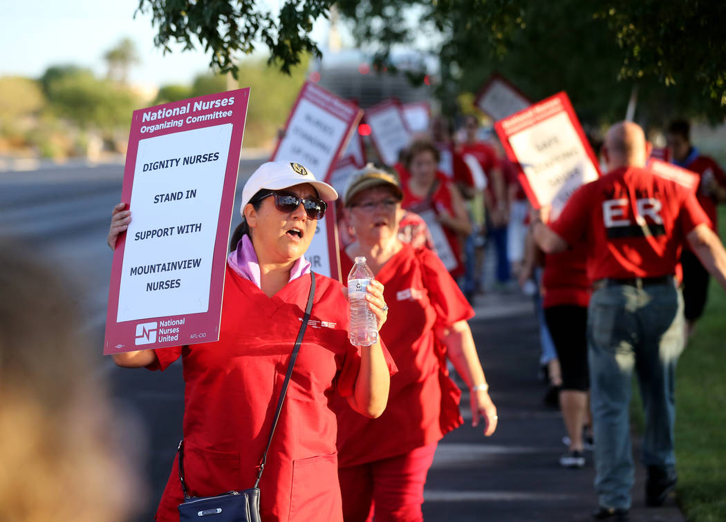 Nurses and supporters affiliated with the Nevada chapter of the national Nurses Organizing Committee, including Toni Stockman, left, protest outside MountainView Hospital in Las Vegas Tuesday, Jul ...