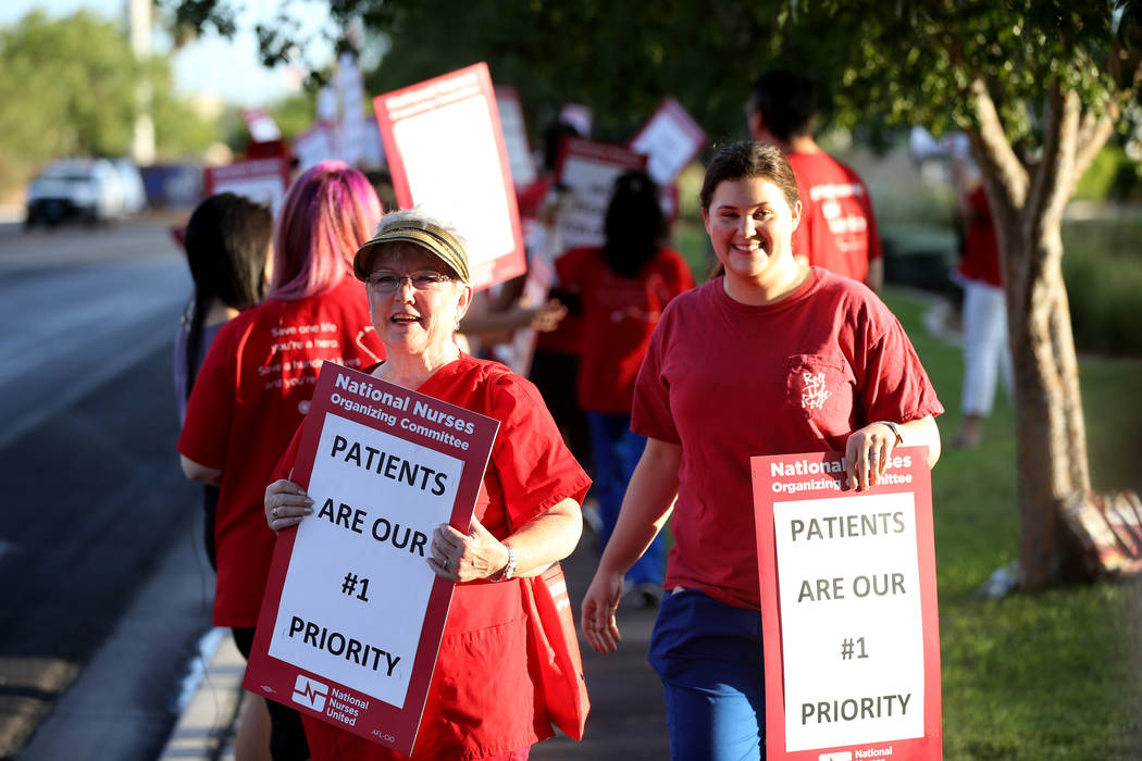 Nurses and supporters affiliated with the Nevada chapter of the national Nurses Organizing Committee, including Chris Garth, front, protest outside MountainView Hospital in Las Vegas Tuesday, July ...
