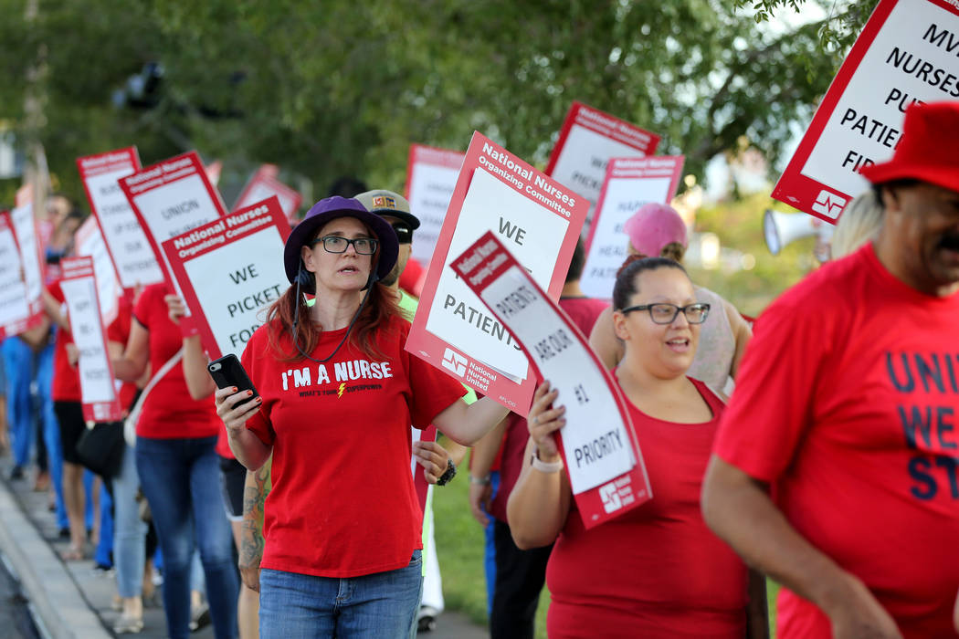 Nurses and supporters affiliated with the Nevada chapter of the national Nurses Organizing Committee, including Mary Ann Nocie, left, protest outside MountainView Hospital in Las Vegas Tuesday, Ju ...