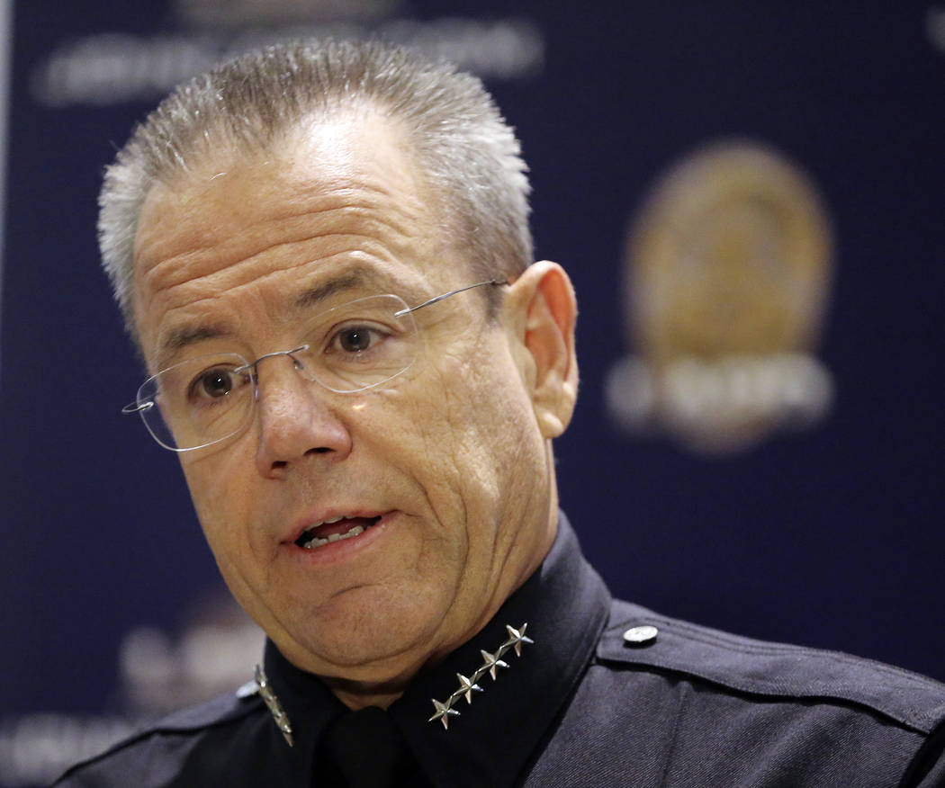 Los Angeles Police Chief Michel Moore speaks at a news conference at police headquarters Tuesday, July 24, 2018, in Los Angeles, where he announced that a store worker killed in a gun battle befor ...