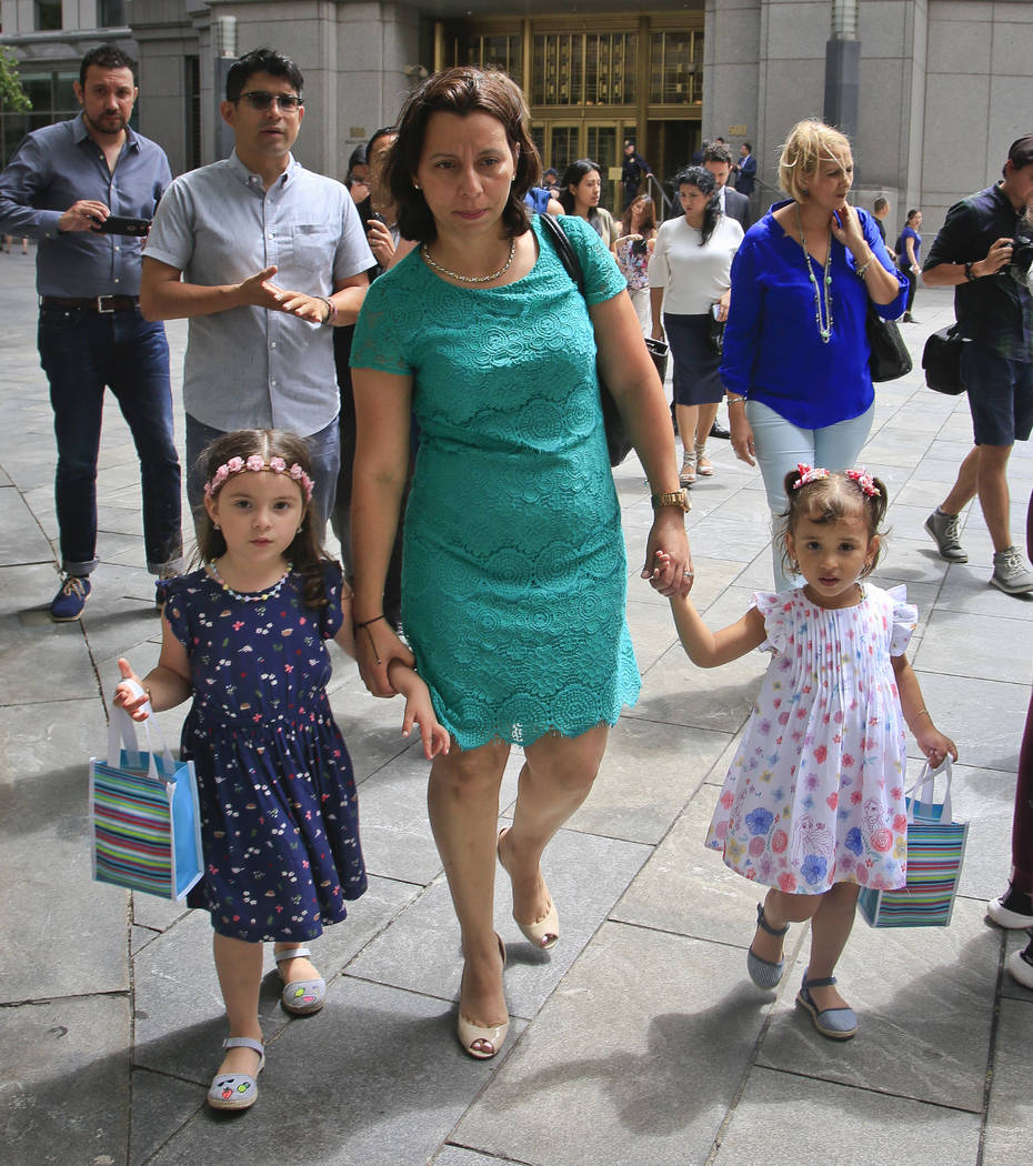 Pablo Villavicencio's wife Sandra Chica, center, and their two daughters, leave federal court after a hearing on his release, Tuesday July 24, 2018, in New York. Villavicencio, a pizza delivery ma ...