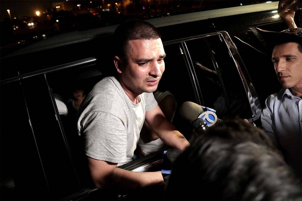 Pablo Villavicencio leans out of an SUV while talking to reporters after being released from the Hudson County Correctional Facility, Tuesday, July 24, 2018, in Kearny, New Jersey. (Julio Cortez/AP)