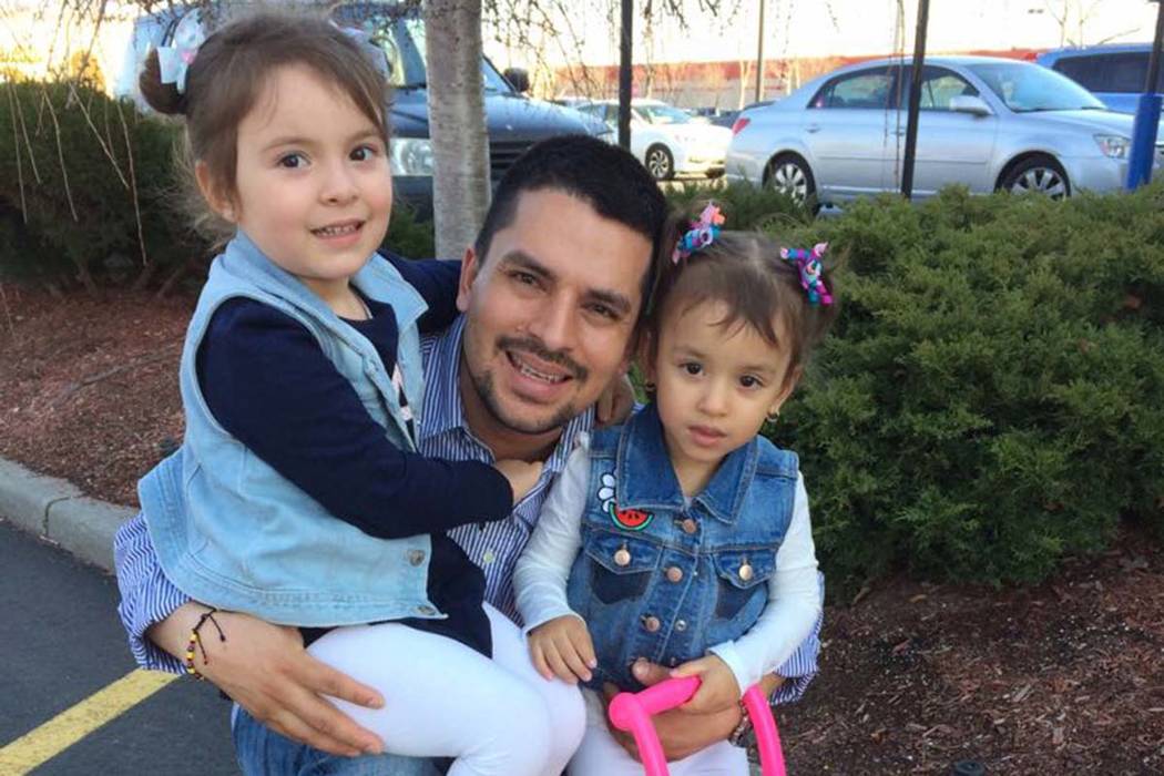In this undated family photo provided by Sandra Chica, Pablo Villavicencio poses with his two daughters, Luciana, left, and Antonia. (Villavicencio Family Photo via AP) .